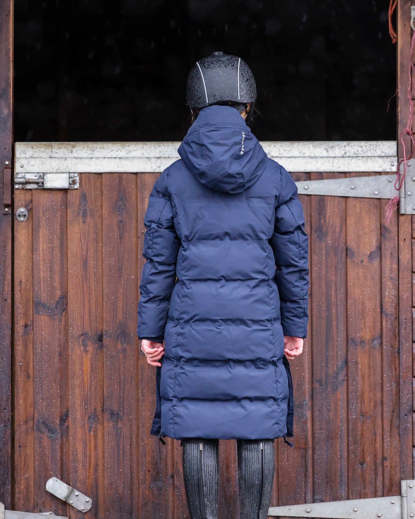 Girl in EQUIDRY Thora Navy Waterproof Riding Puffer Coat