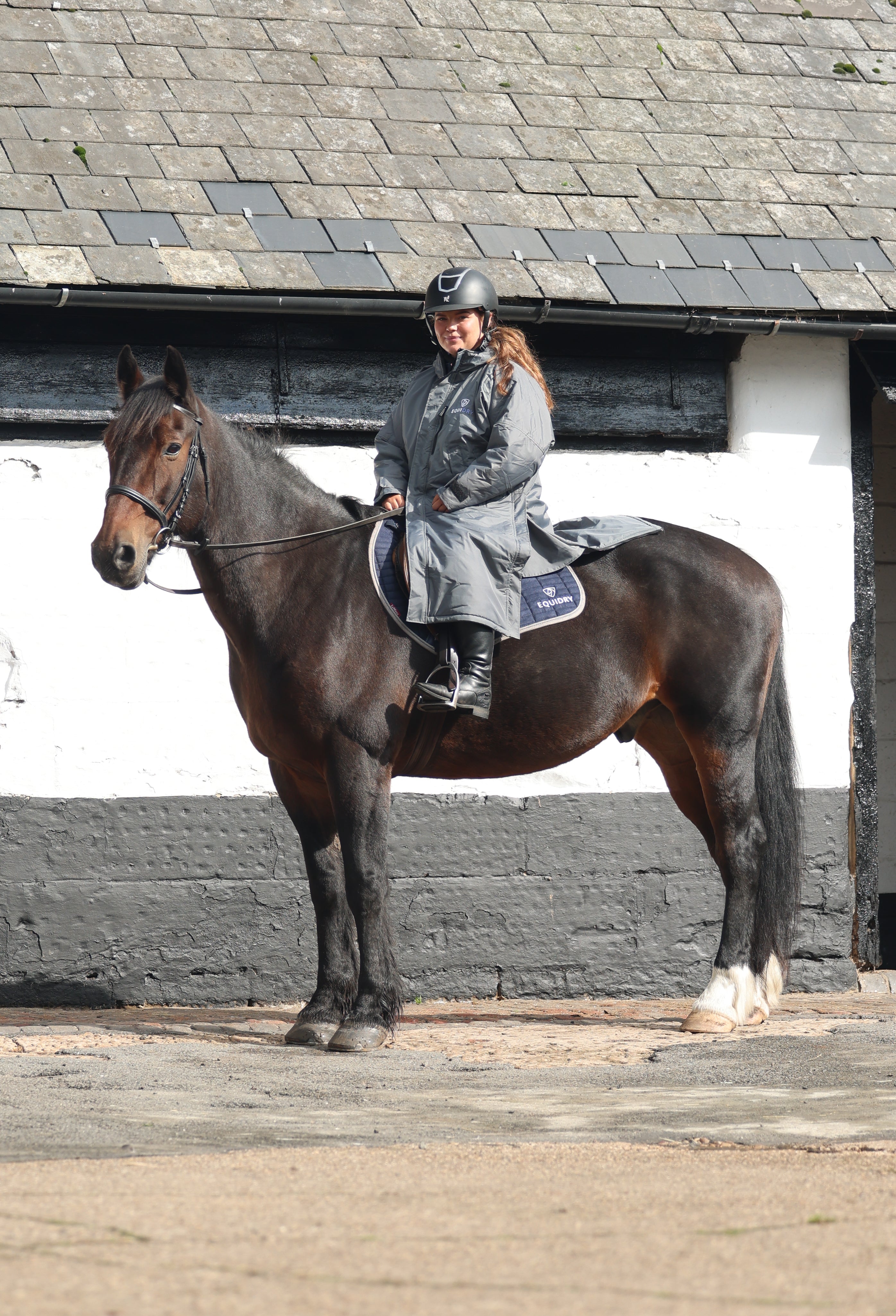 Equestrian with Horse in Equidry Waterproof Coat. Horse Riding Gear.