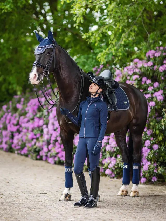 Equestrian style: Woman with horse showcasing LeMieux Loire Twilight Navy dressage saddle pad from Equiflair. #horseriding