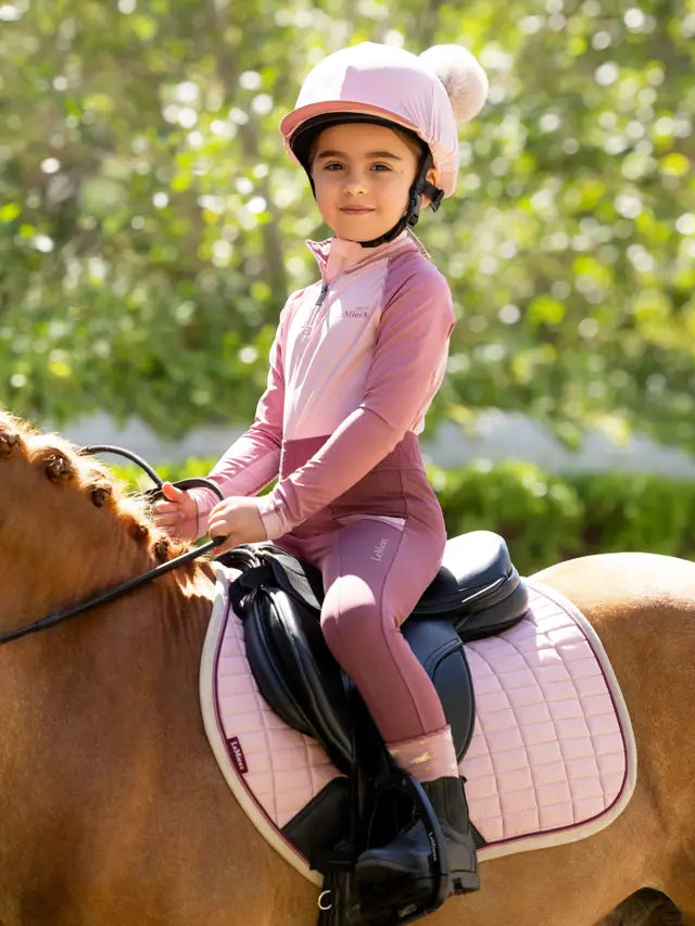 Girl on Horse with Lemieux Blossom Double Pom Hat & Matching Riding Outfit | Equiflair