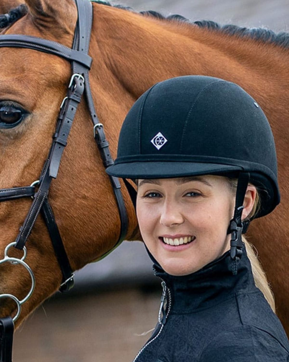 Girl in Charles Owen YR8 Junior Navy Riding Helmet with Horse - Equestrian Safety