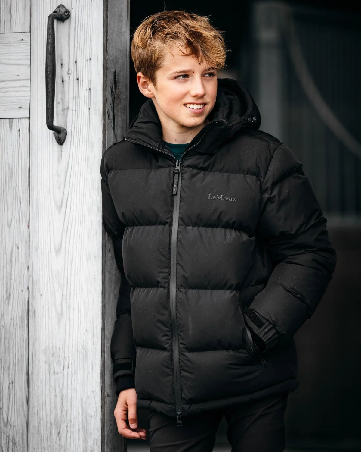 Young Boy in LEMIEUX Puffer Jacket - Black Elite Riding Jacket for Boys Winter Wear - Equiflair