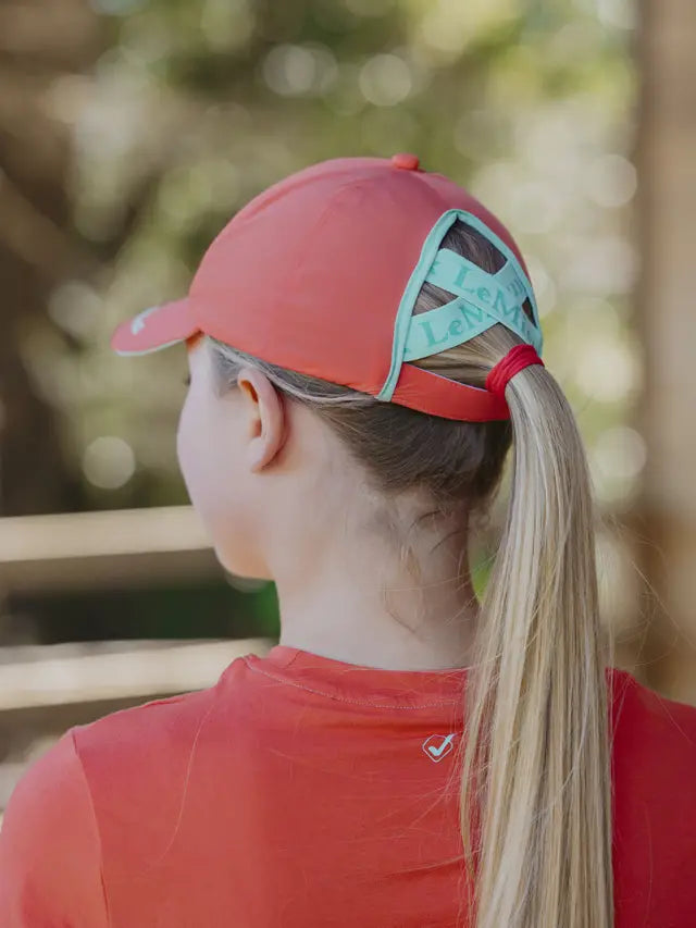 LEMIEUX HARLOW CAP CORAL CRUSH for equestrian style. Coral hat with ponytail opening. Buy now at Equiflair!