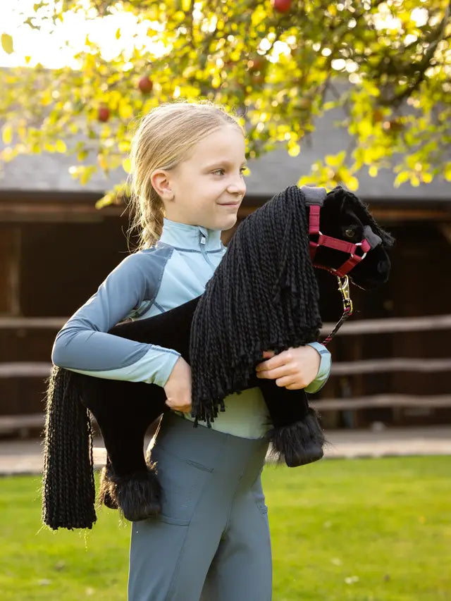 Girl with LeMieux Toy Pony Spike Black Friesian - Perfect for Young Equestrians! Toy Horse Play