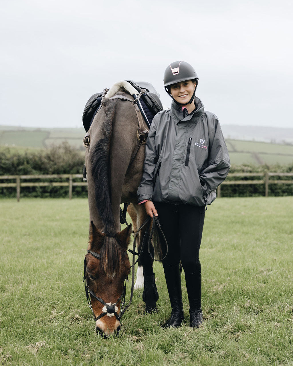 Shortie Child's Oversized Short Waterproof blouson style Riding Jacket Thin Fleece Lining Stowaway Hood in charcoal/penelope pink girl with horse grazing