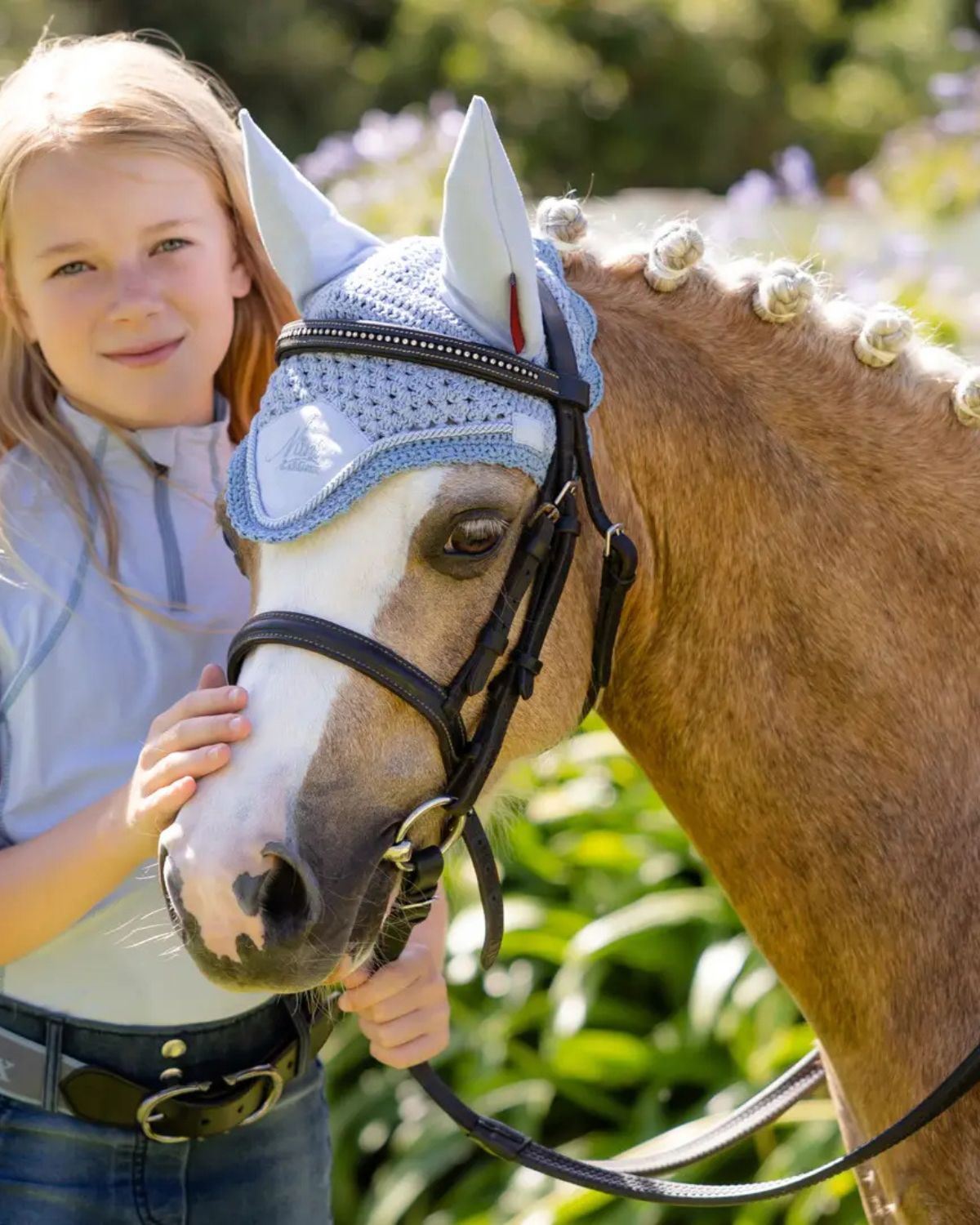 LeMieux Mini Fly Hood Mist on Pony with Girl. Equiflair Pony Fashion. Comfortable and Stylish Pony Protection.