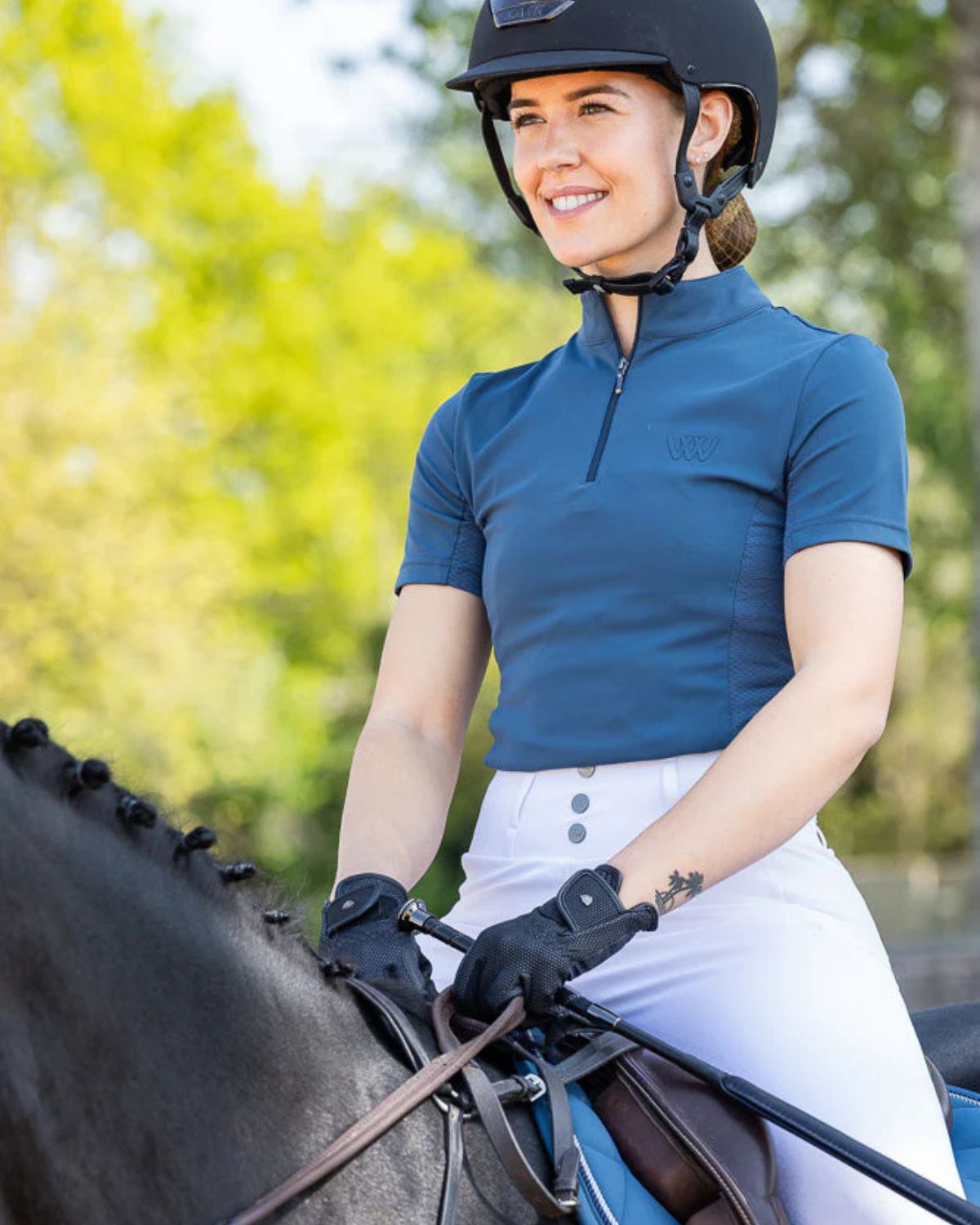 Woof Wear Petrol Blue Riding Shirt: Woman on Horseback Wearing Technical Equestrian Top
