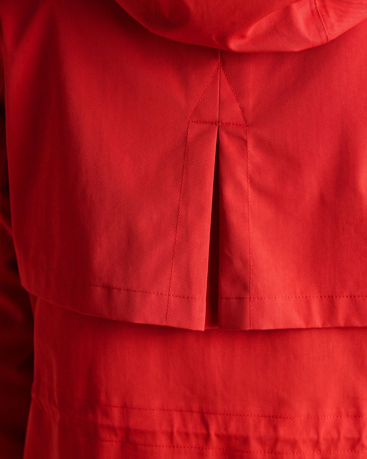 JOULES PORTWELL Red Waterproof Raincoat: Hood, Storm Flap, and Adjustable Details