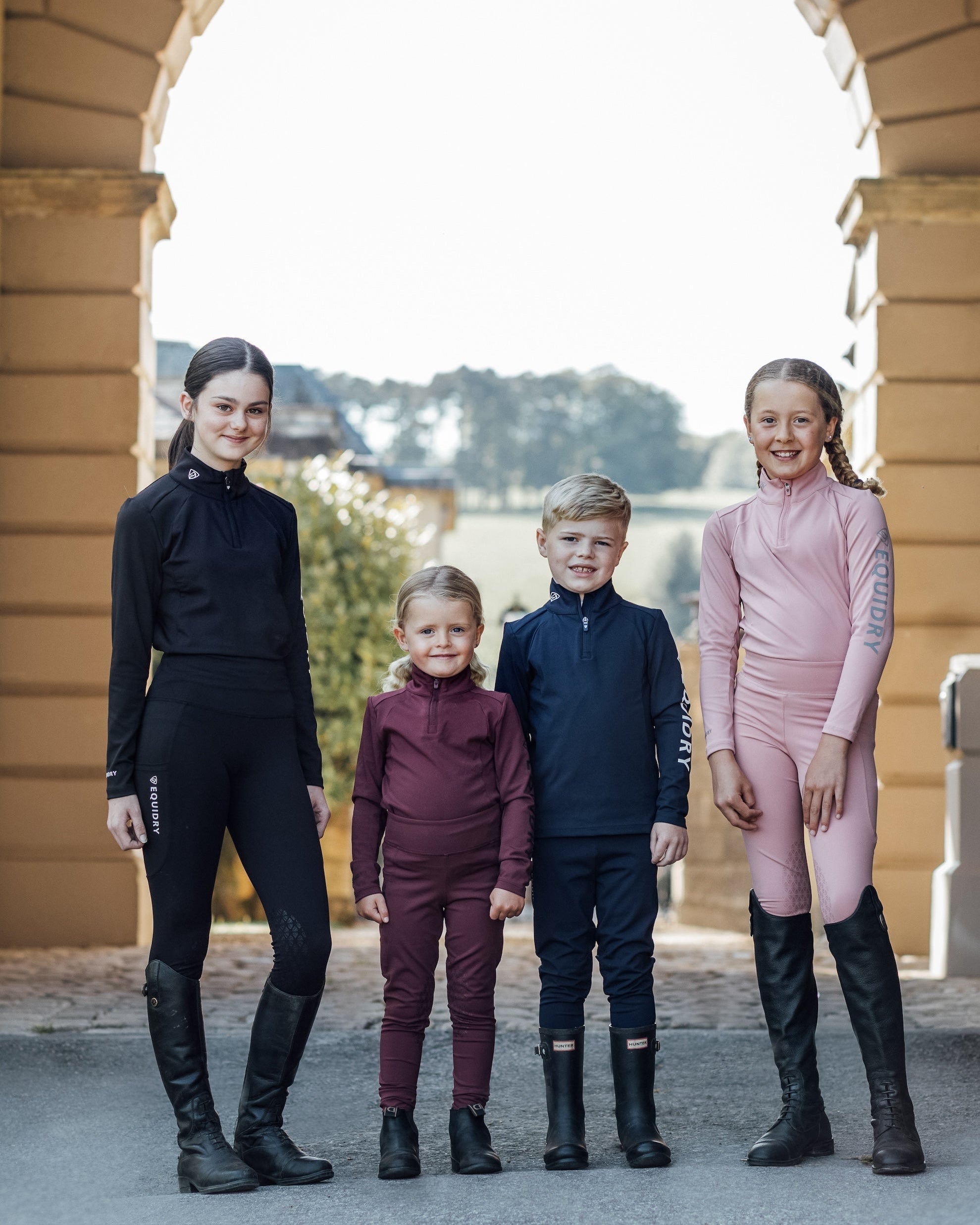 EQUIDRY Children's Equestrian Apparel: Base Layer Collection by Equiflair. Kids Riding Gear in Black, Pink, Burgundy and Blue