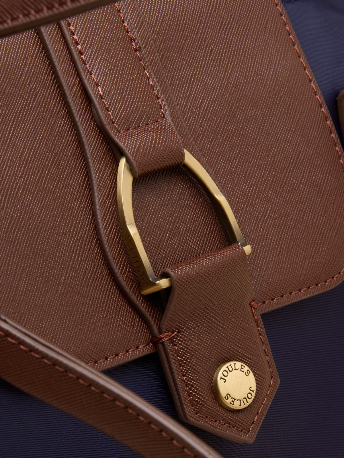 Joules Edie shopper bag navy detail: brass logo stud & stirrup buckle.