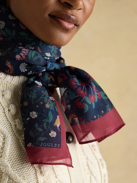 Joules Abberton Navy Scarf: Woman wearing lightweight floral print scarf from Equiflair Saddlery.
