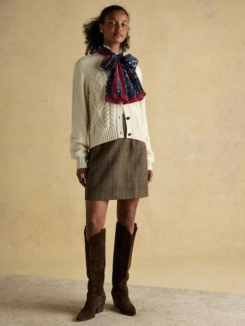 Equiflair Saddlery: Woman in Joules Abberton Navy Lightweight Printed Scarf, cardigan, mini skirt, boots.