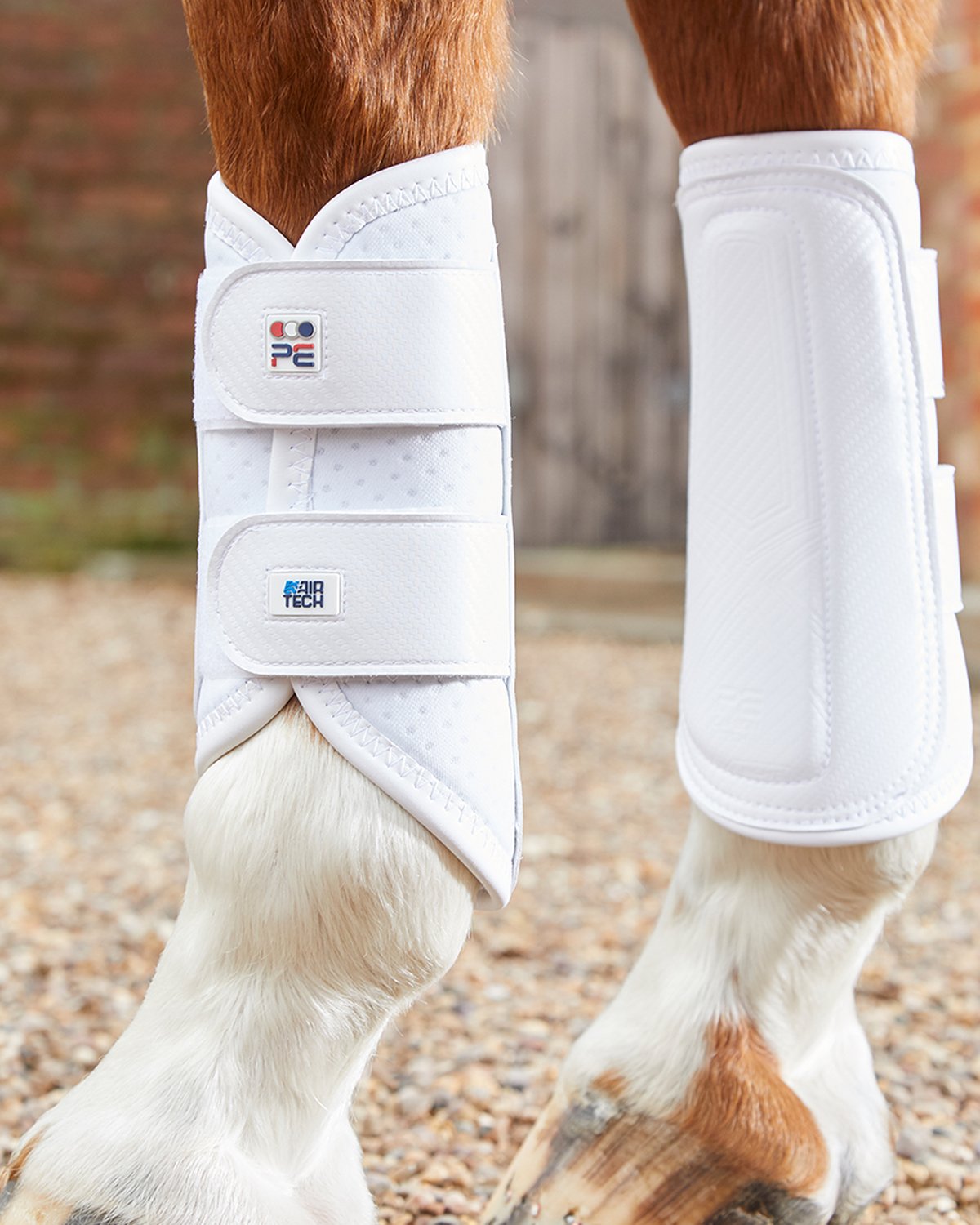 White Premier Equine Carbon Air-Tech Double Locking Brushing Boots at Equiflair. Horse Leg Protection.