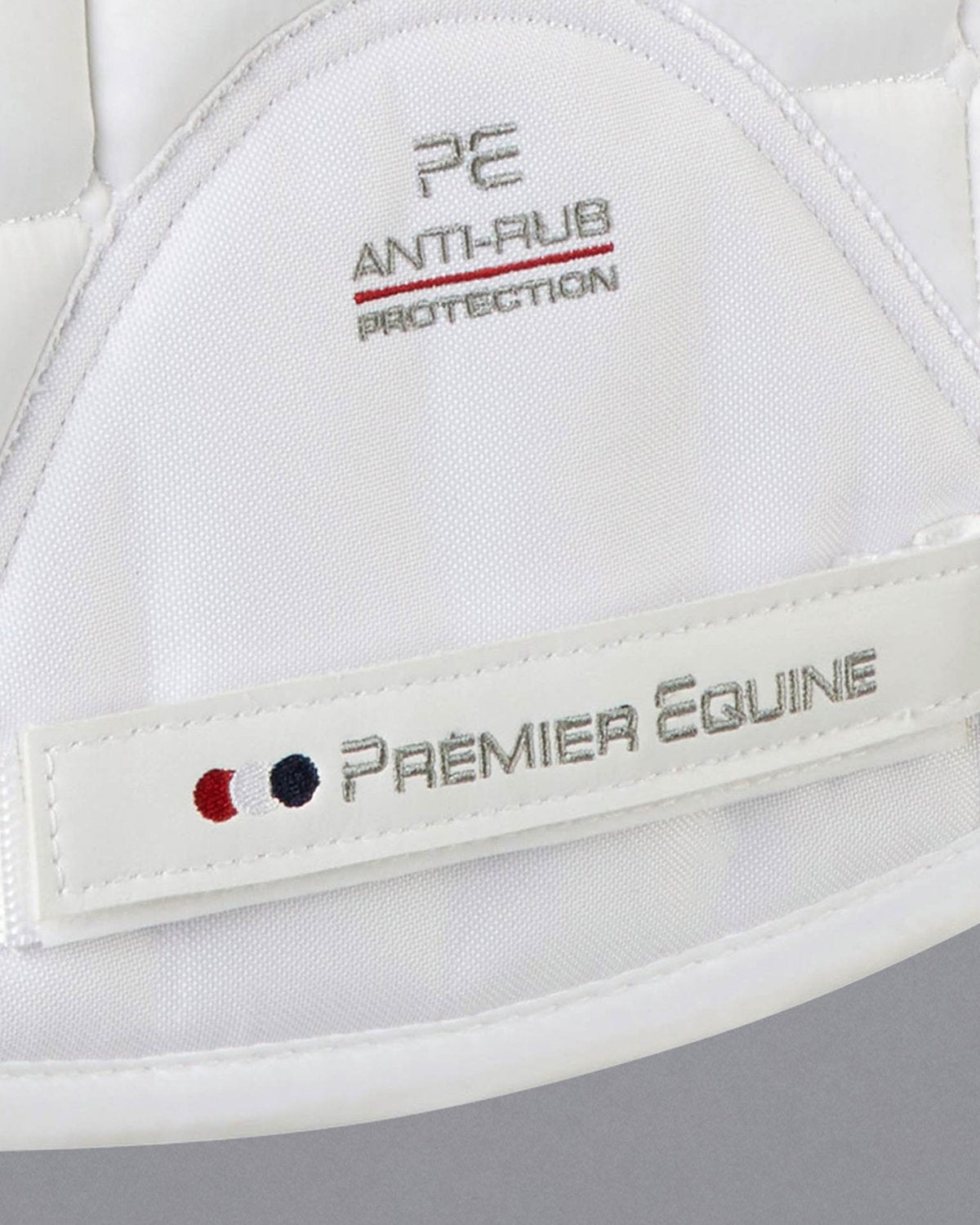 Premier Equine White Saddle Pad Detail: Anti-Rub Protection, Branding Logo. Equestrian Horse Riding Equipment