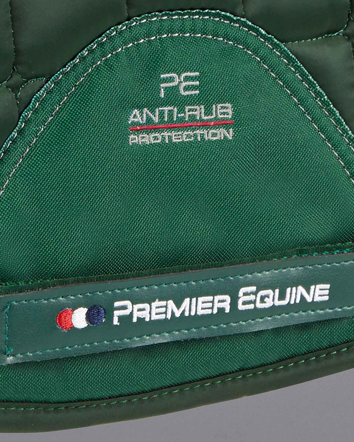 Premier Equine Atlantis Olive Saddle Pad: GP/Jump, Anti-Rub Protection, Wool Lined. Equestrian Comfort and Style.