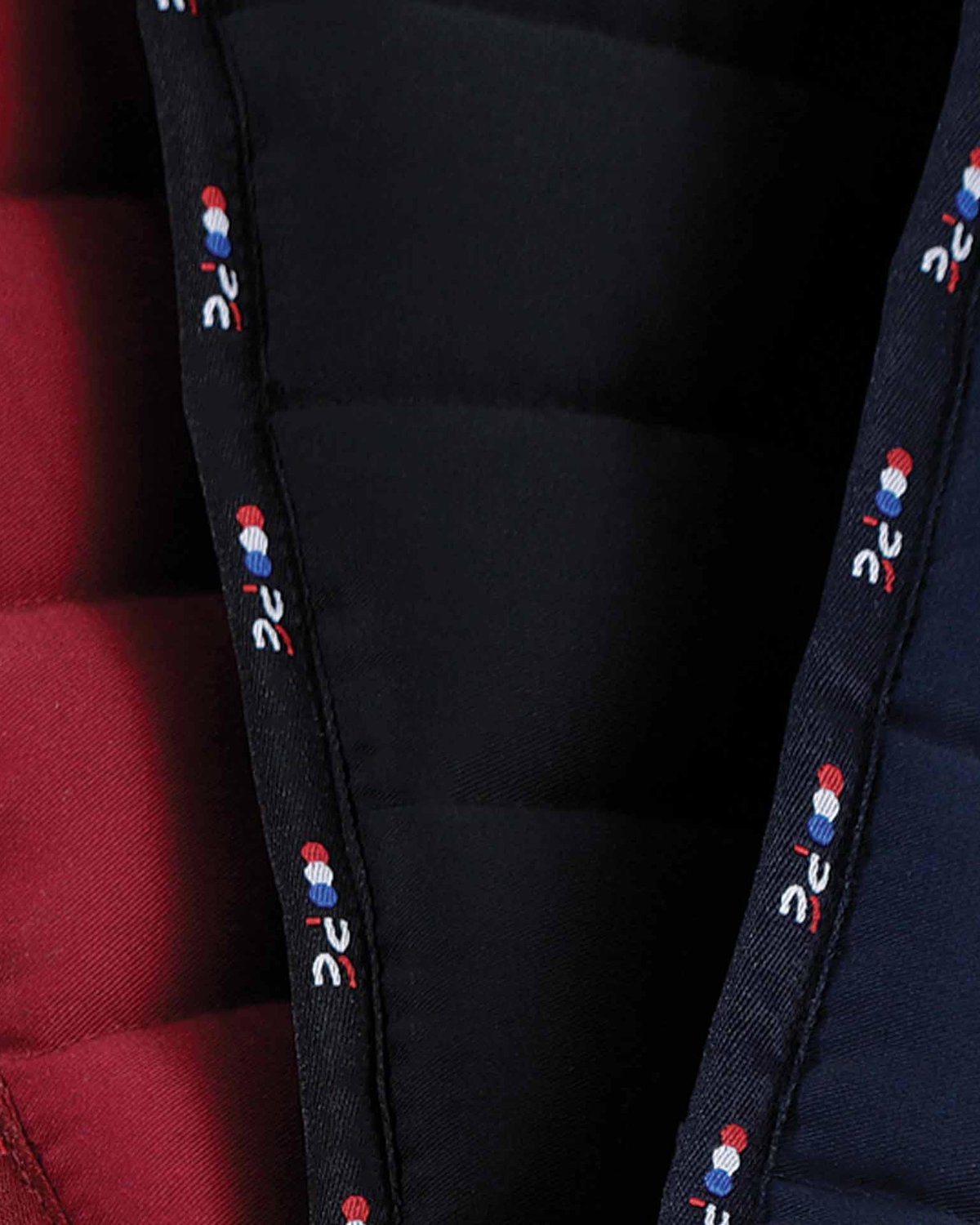 PREMIER EQUINE Buster Reversible Saddle Pad in Black - Close up detail of reversible design.