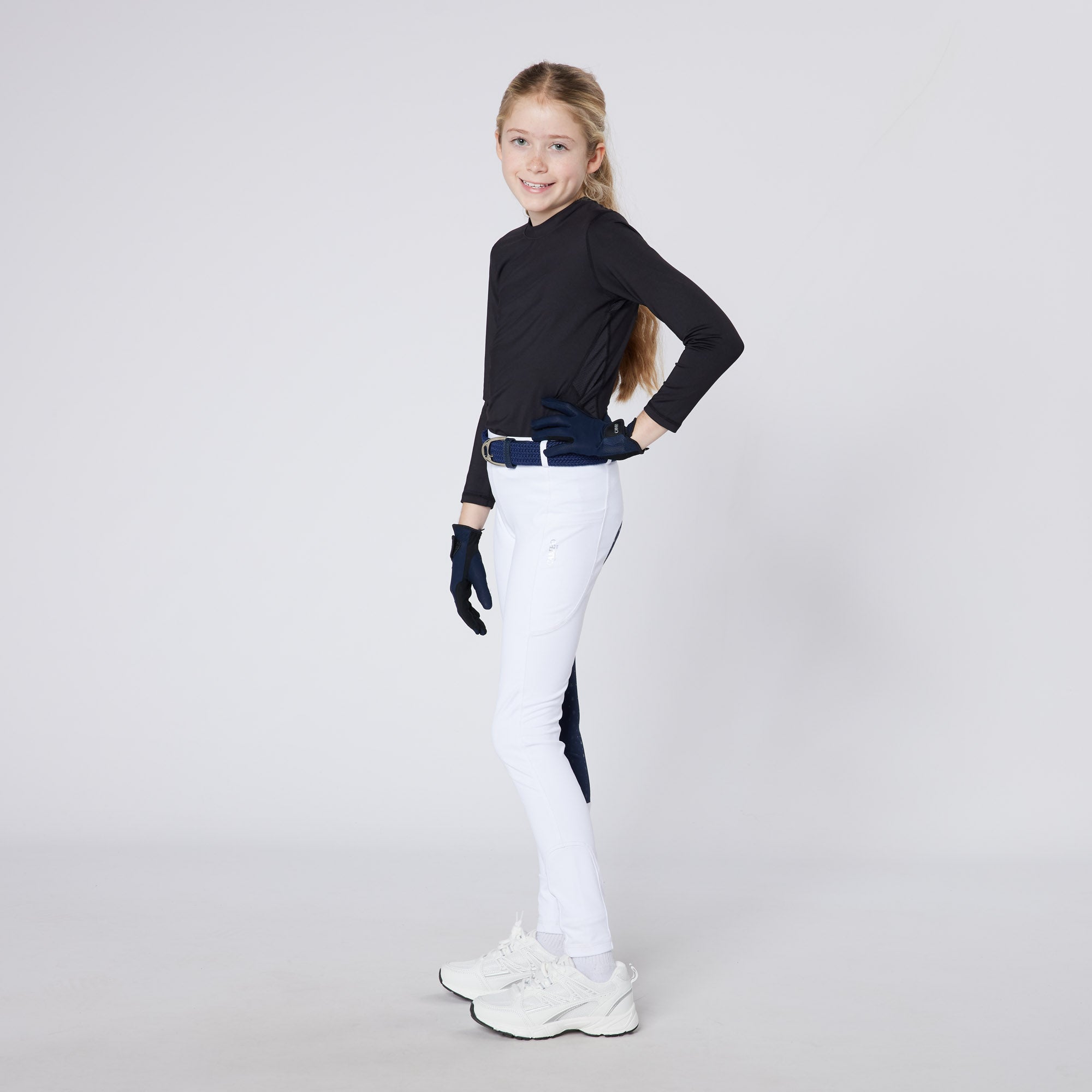 Girl in White Riding Tights and Black Shirt: Junior Equestrian Apparel