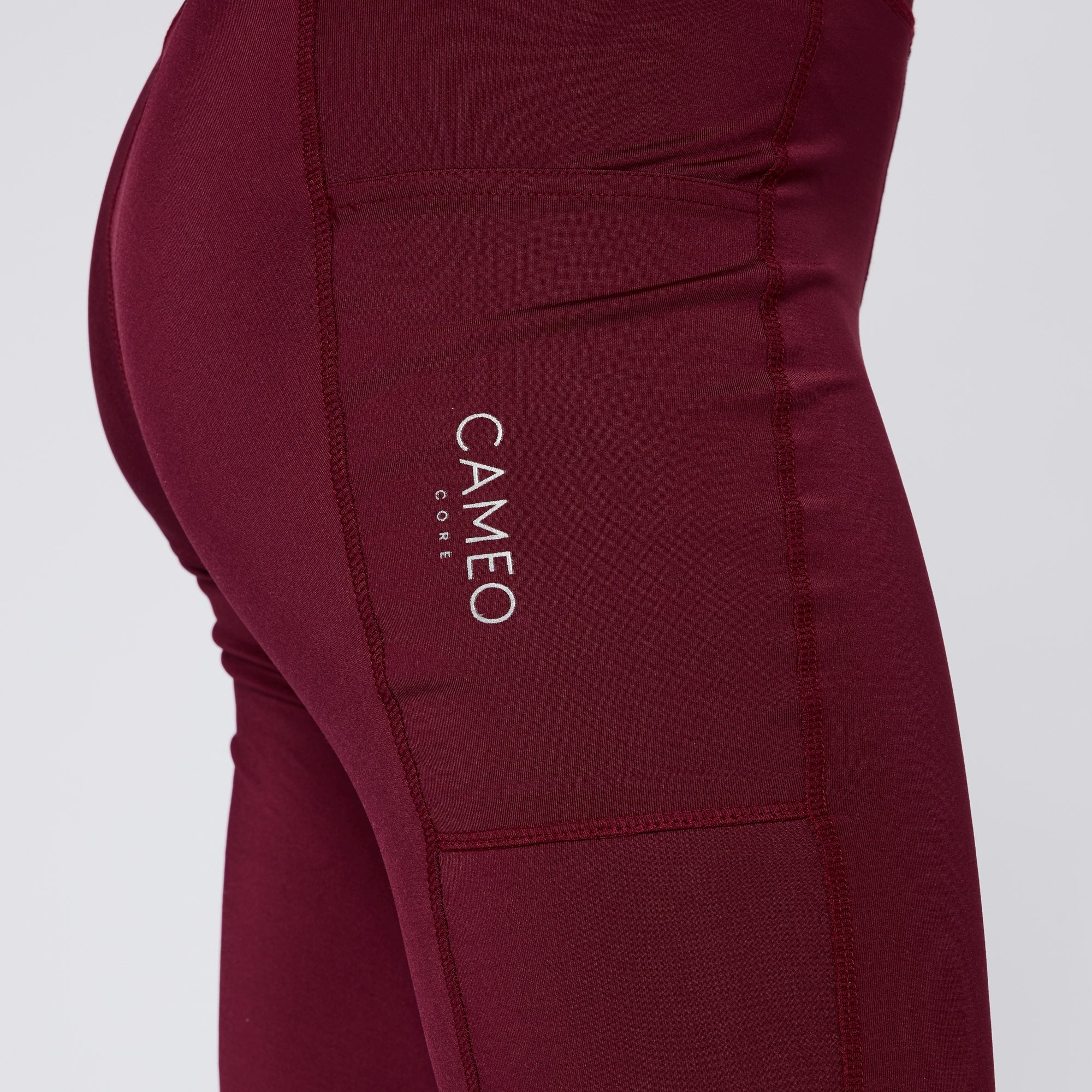 CAMEO CORE COLLECTION TIGHTS CRIMSON. Equiflair riding tights featuring CameoTech fabric, phone pocket, knee silicone, and reflective logo.