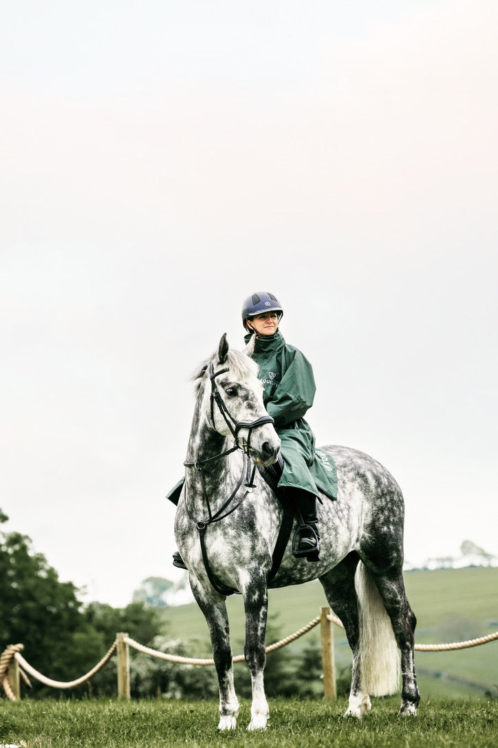 EQUIDRY Black Forest Green Equimac Long waterproof coat lightweight raincoat worn by woman horse riding