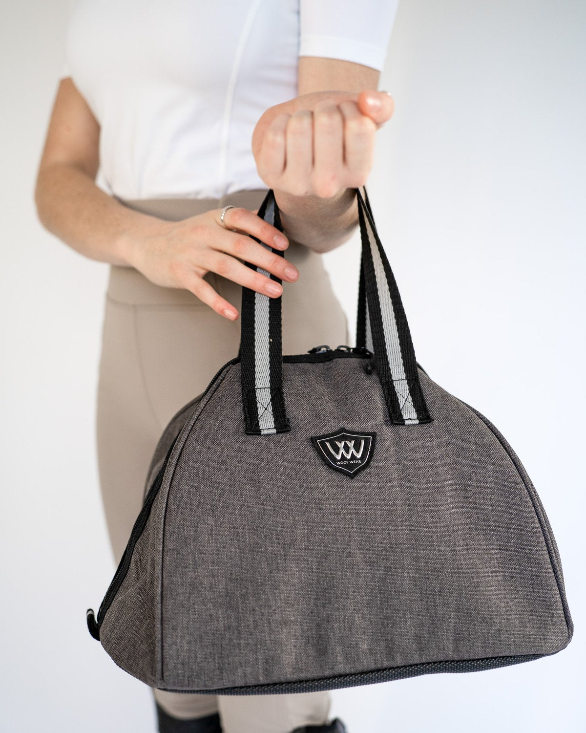 WOOF WEAR Riding Hat Bag - Grey and Black Bowling Style Bag being Held
