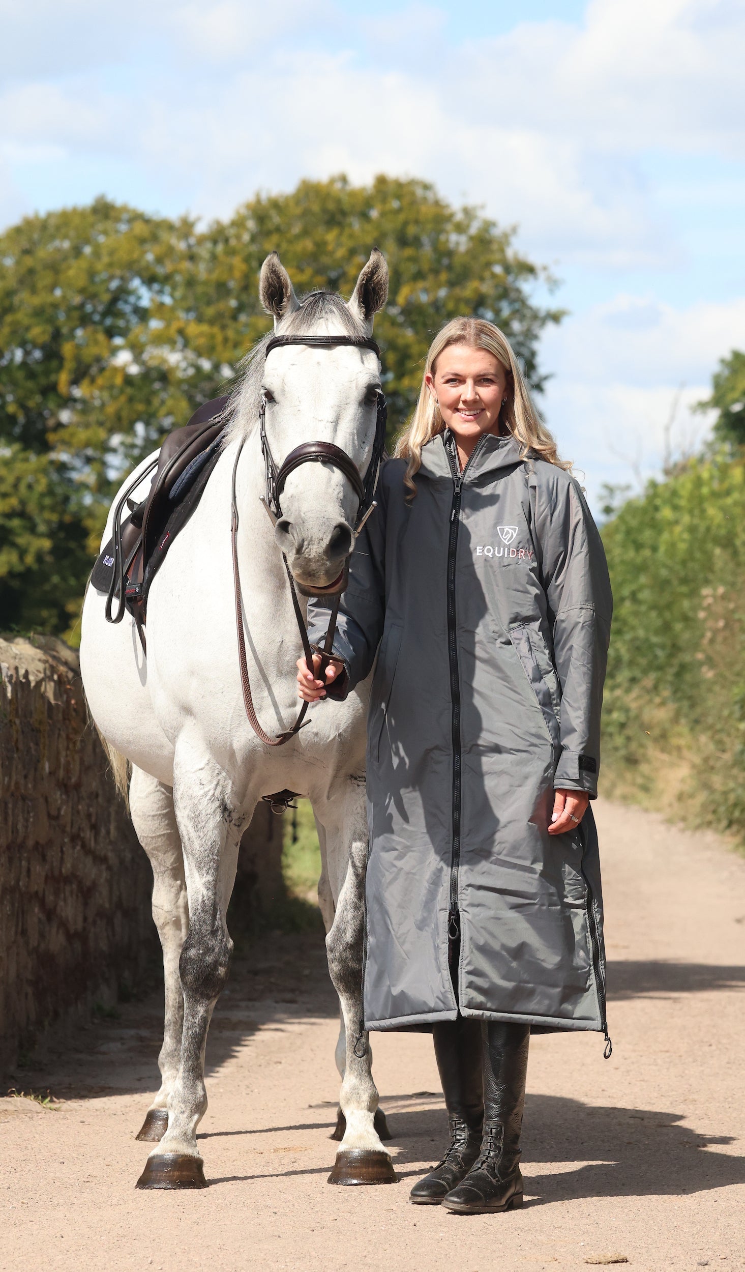 EQUIDRY waterproof horse riding raincoat All Rounder Original thick fleece Women's Charcoal/Pale Pink full front view with horse