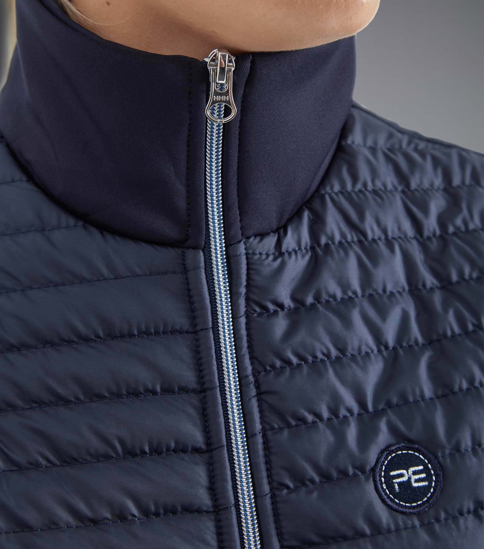 Premier Equine Ladies Navy Hybrid Riding Jacket: Quilted gilet, technical jersey, moisture-wicking, YKK zipper, PE branding.