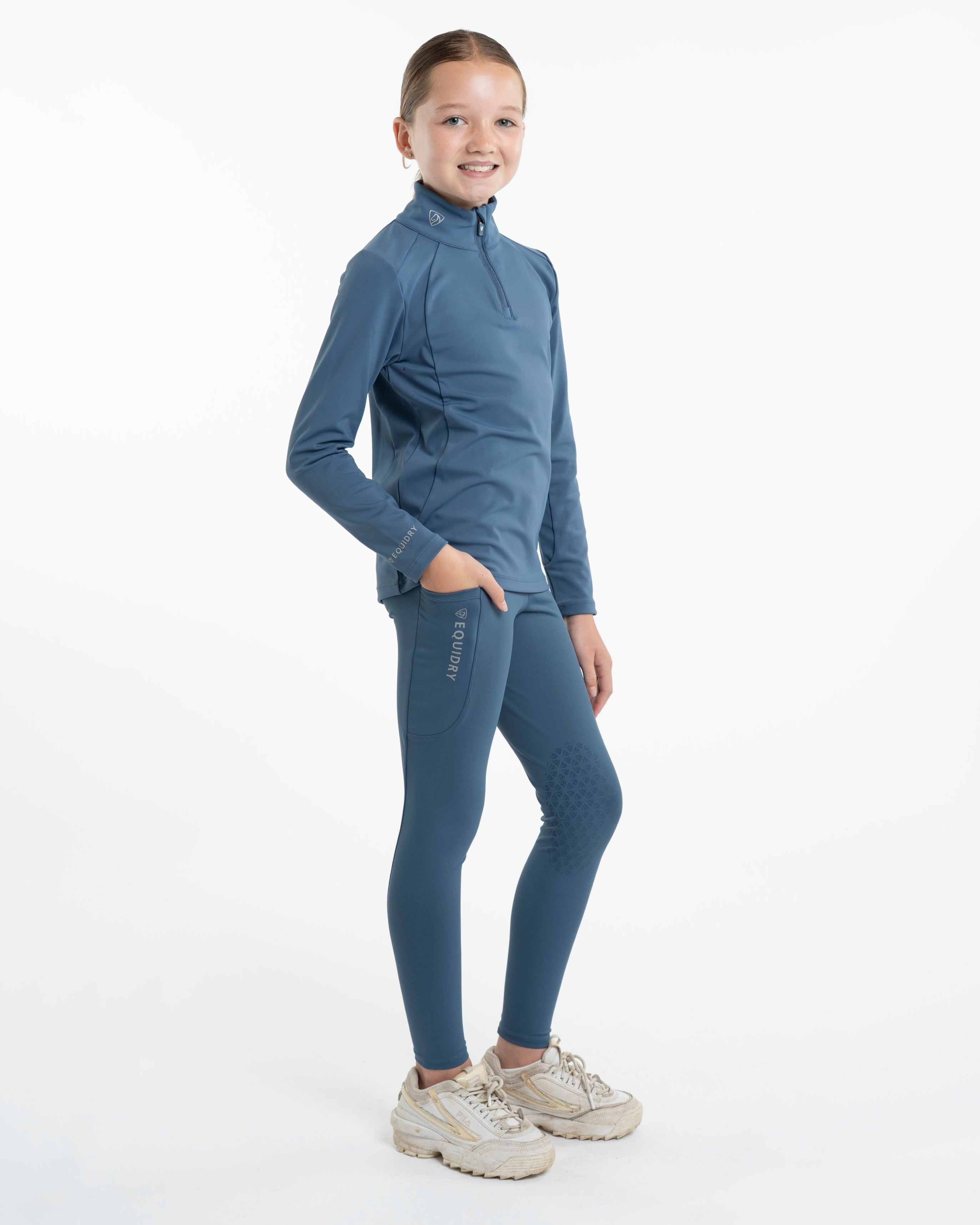 Kid's Equestrian Riding Leggings: Water-Resistant, Knee Grip. Steel Blue. Stylish and functional riding apparel.