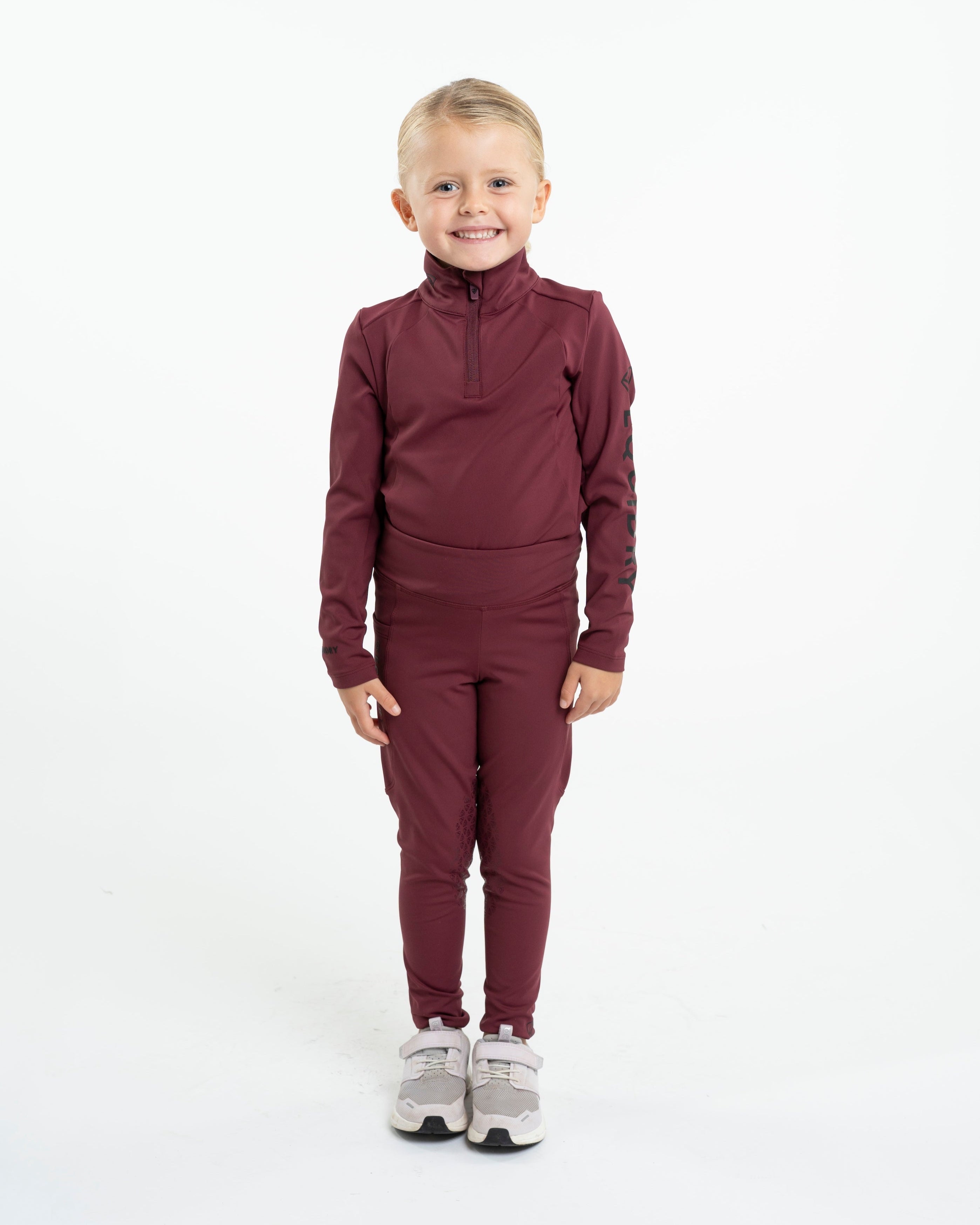 Equestrian Base Layer by Equiflair: Children's Plum Water Repellent Riding Apparel. Perfect for young riders.