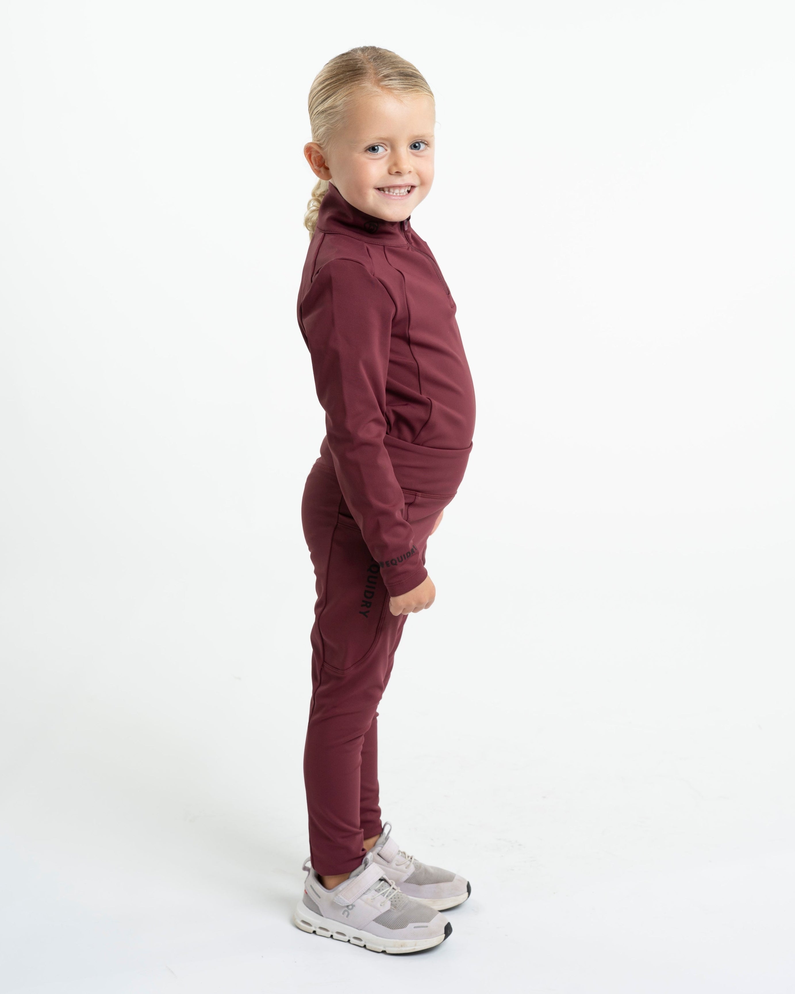 EQUIDRY Water Repellent Leggings: Plum/Black, Knee Grip, Children's Riding Apparel. Young Girl Modeling Equestrian Clothing.