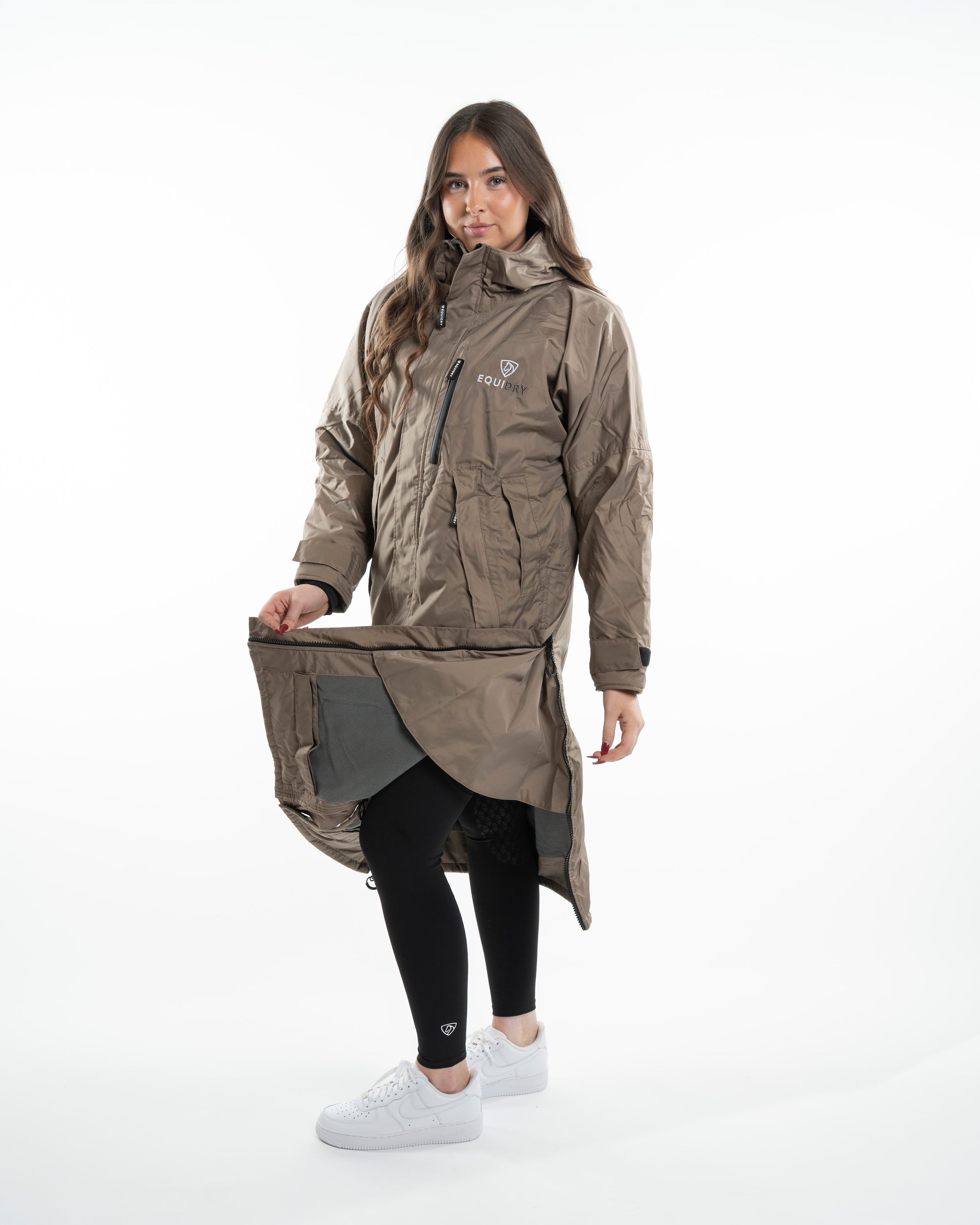 Equidry Evolution Women's Thin Fleece Taupe Waterproof Riding Coat by Equiflair. Oversized, fleece-lined, and ready for any weather.