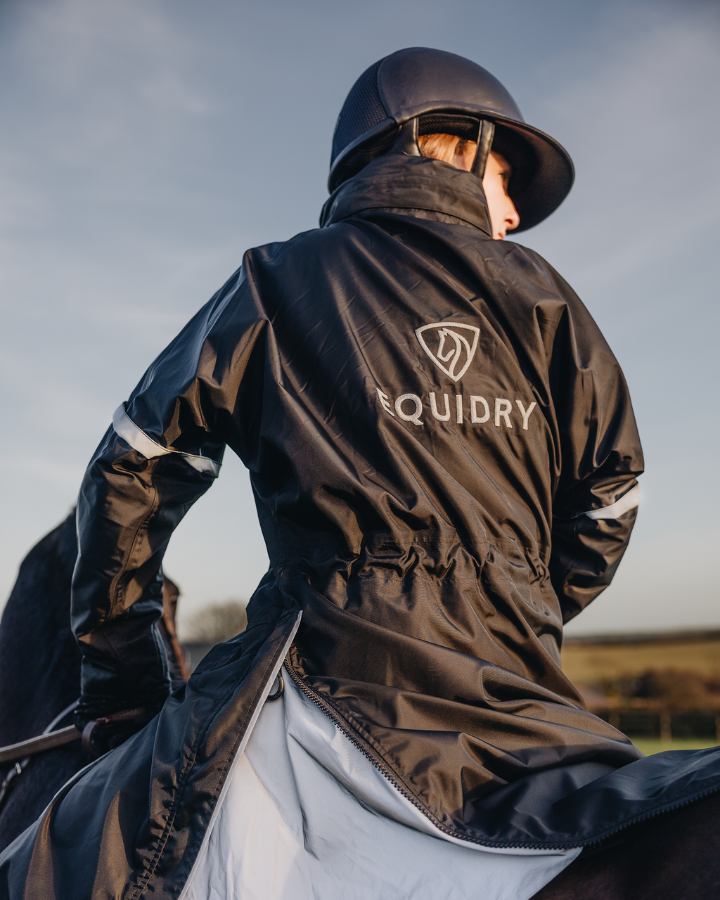 Evolution Children's | Thin Fleece | Stowaway Hood | Reflective | Black Forest Green - EQUIDRY waterproof riding coat on horse
