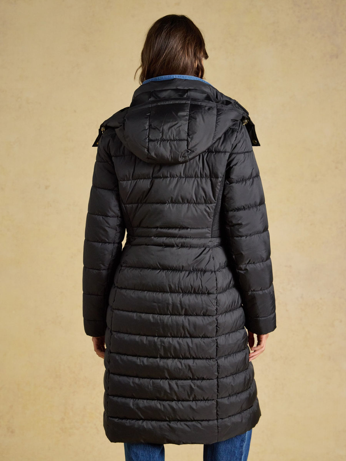 Women's black Joules longline padded coat with hood - showerproof, warm, and stylish winter outerwear.