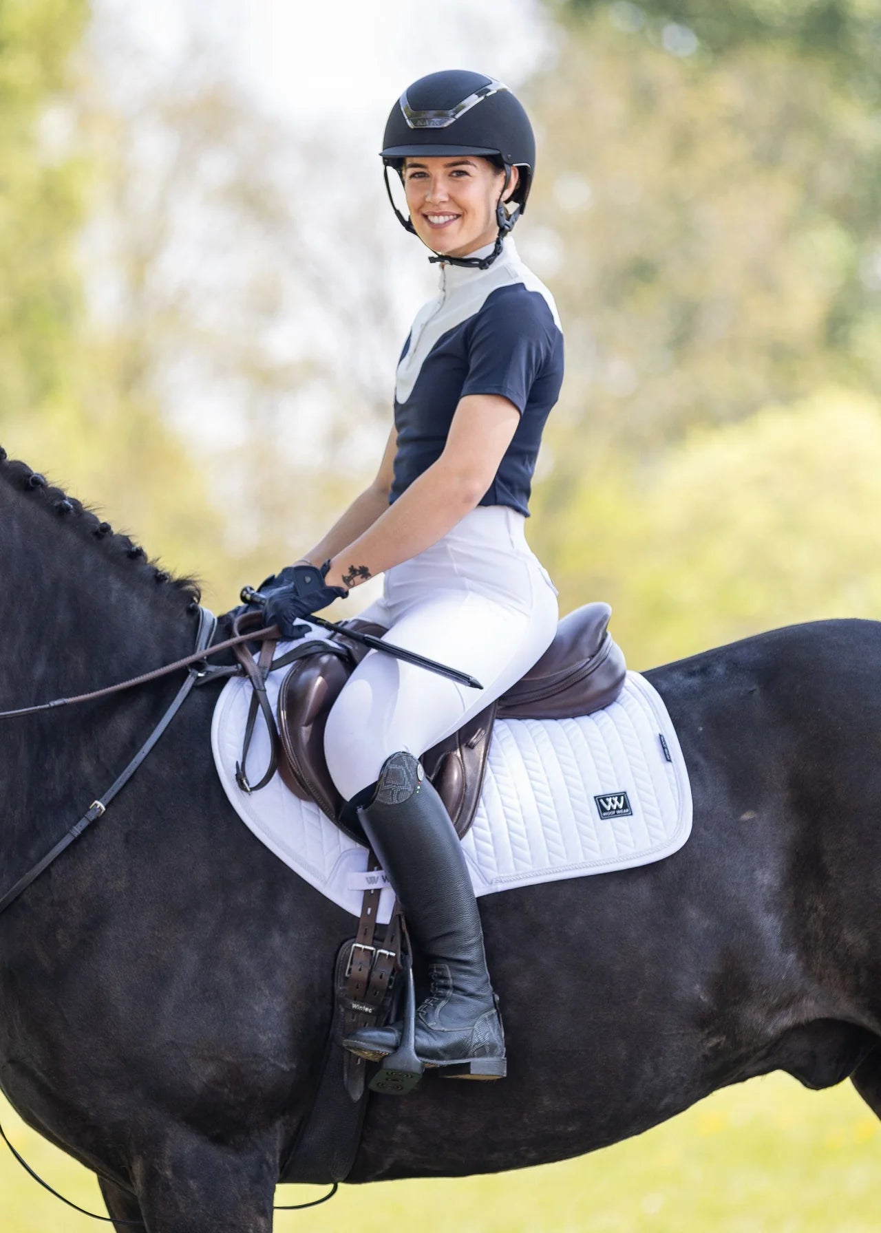 Woman Horseback Riding in White Woof Wear Herringbone Saddle Pad. Equestrian Fashion.