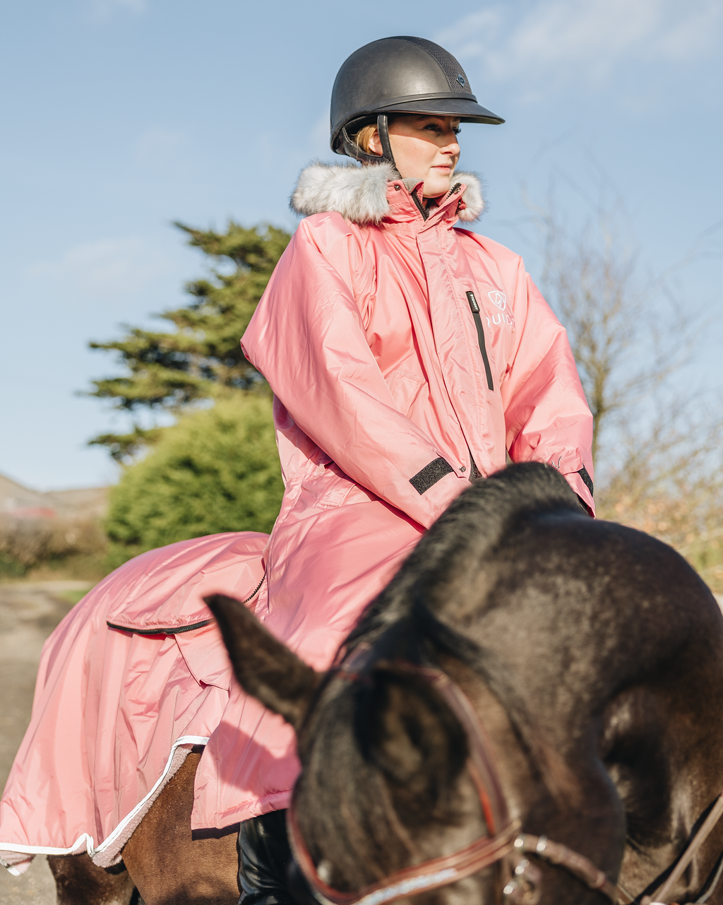 EQUIDRY Evolution Lux Women's Warm Waterproof Winter Horse Riding Coat Thick Fleece Lining with Faux Fur Trim Hood dusky pink on horse