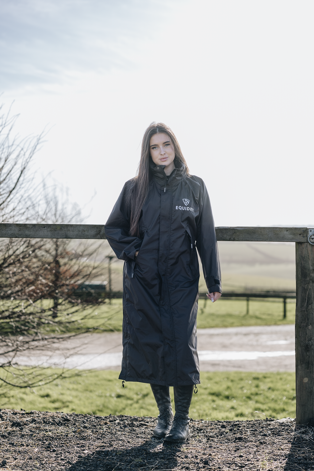 EQUIDRY women's thin fleece stowaway hood long waterproof horse riding coat in rich brown lifestyle