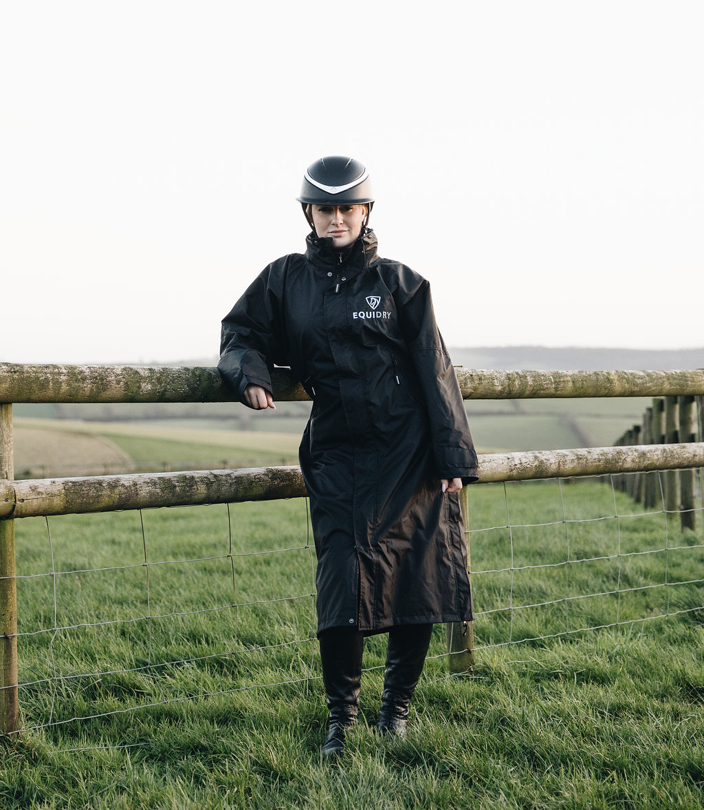 EQUIDRY Black Equimac Long waterproof riding coat lightweight raincoat worn by young horse rider