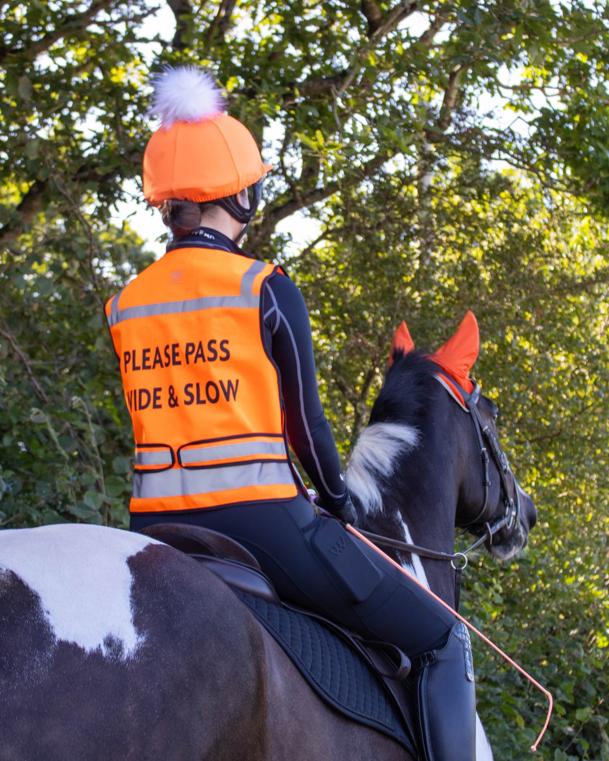 Horse Rider in Woof Wear Hi-Vis Vest: Stay Safe & Seen! High Visibility Riding Gear for Equestrians - Horse and Rider Safety