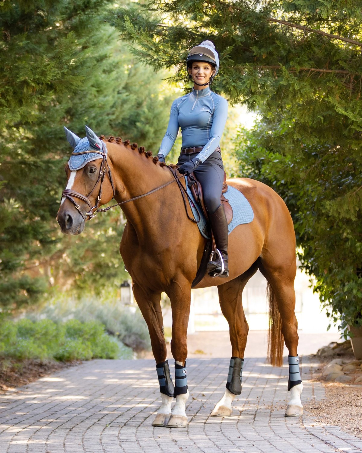 Equestrian Rider on Horse with LeMieux Ice Blue Saddle Pad. Classic look by Equiflair.