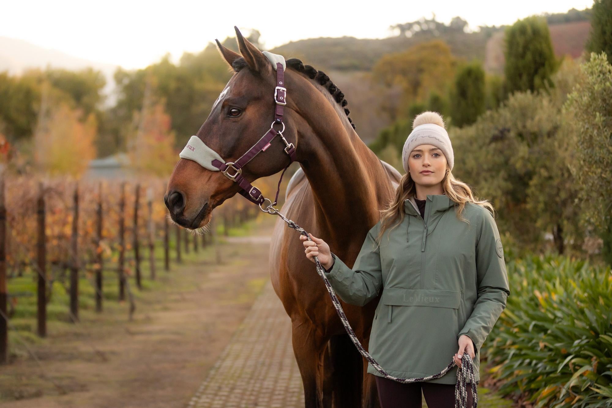 Woman with horse wearing Lemieux Phoebe Waterproof Anorak Rosemary from Equiflair - equestrian fashion.