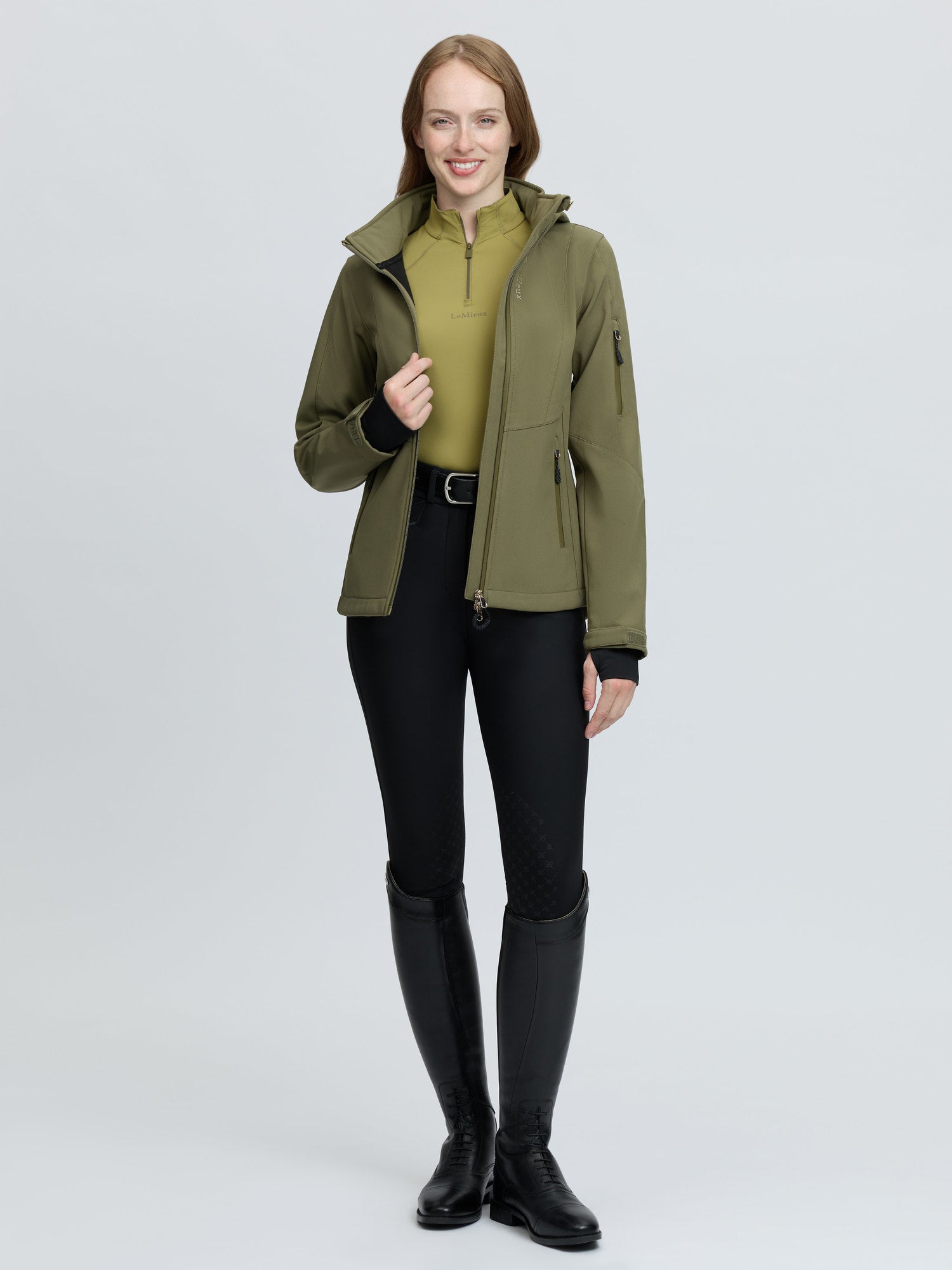 Women's green Lemieux Celine softshell riding jacket with hood - perfect for equestrian activities