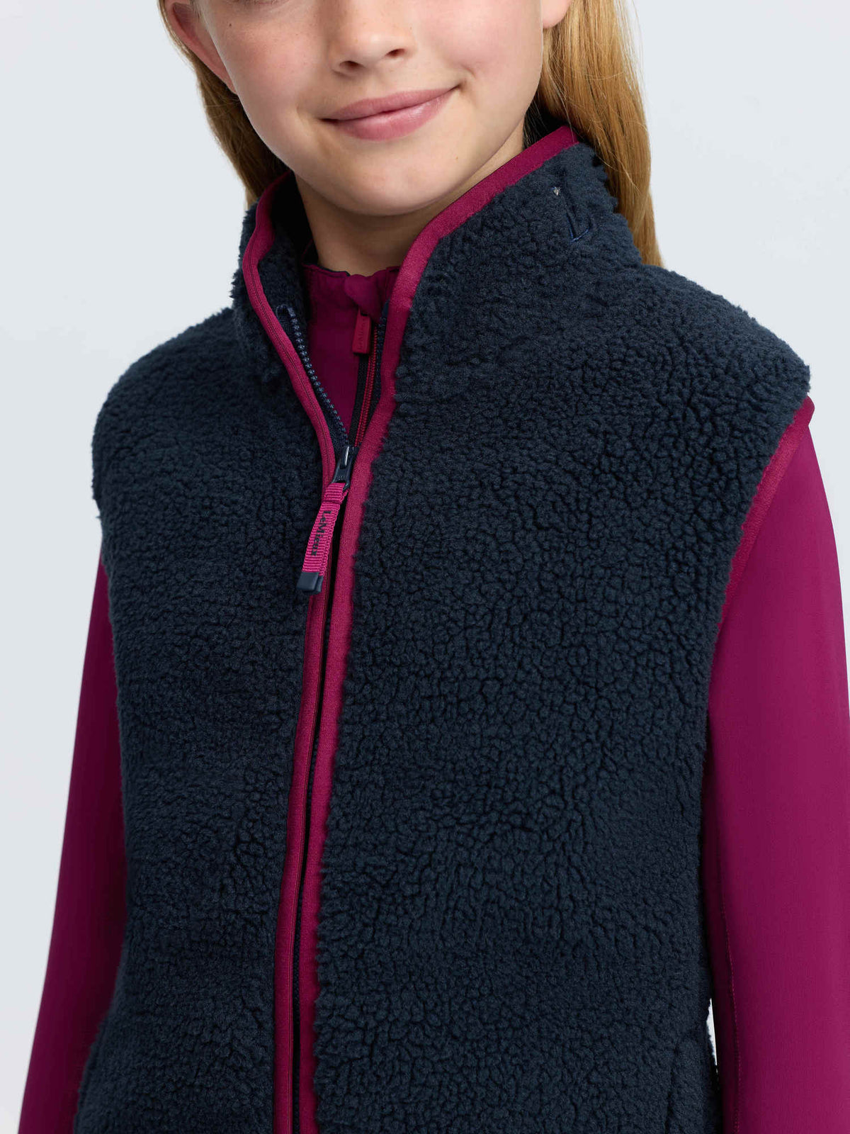 LeMieux young rider navy teddy fleece gilet with pink trim and two-way zip