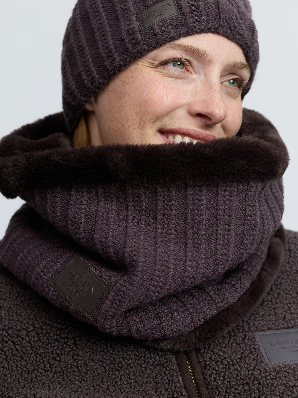 LeMieux Heritage knitted cocoa snood with faux fur trim and embossed logo.