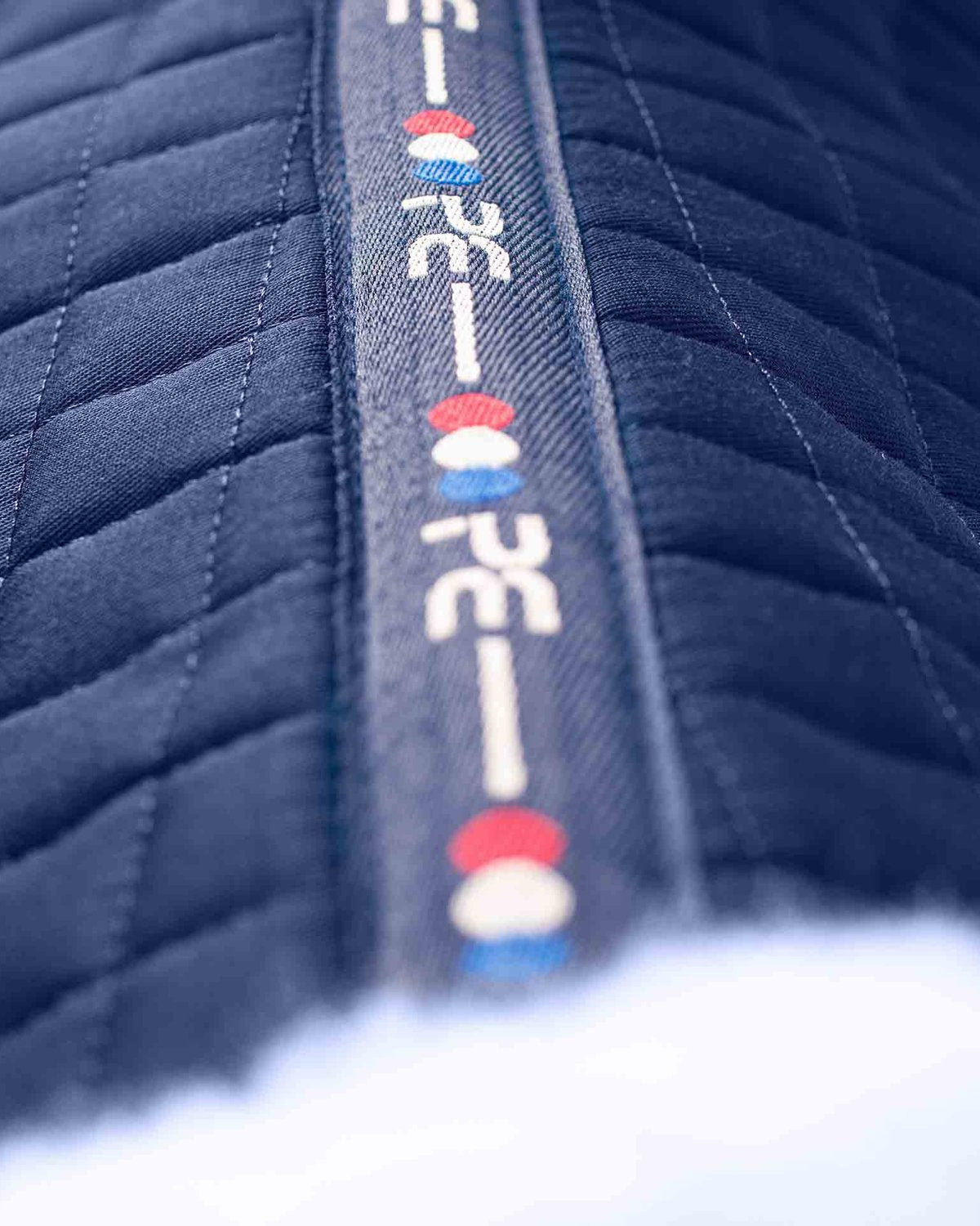 Premier Equine Merino Wool Saddle Pad - Navy. Quilted Equestrian Half Pad for Horses, Comfortable & Stylish Riding Equipment.