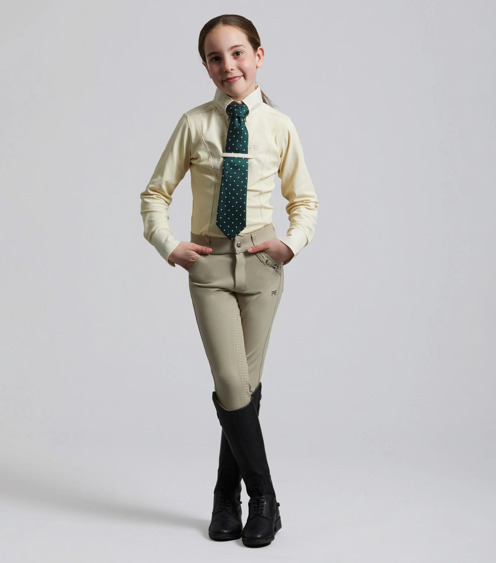 Girl in Premier Equine Tessa Vanilla Riding Shirt - Equestrian Show Attire
