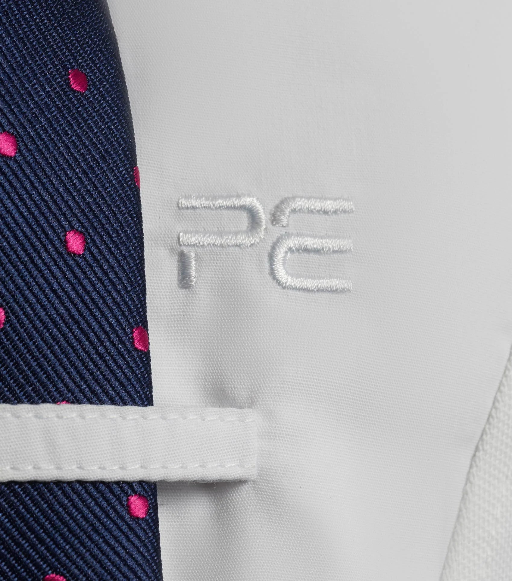Premier Equine girls show shirt: White long sleeve riding apparel for competitions. Moisture wicking, four-way stretch.