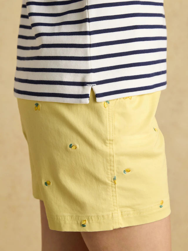 Joules Striped Top & Yellow Pineapple Shorts: Stylish summer outfit.