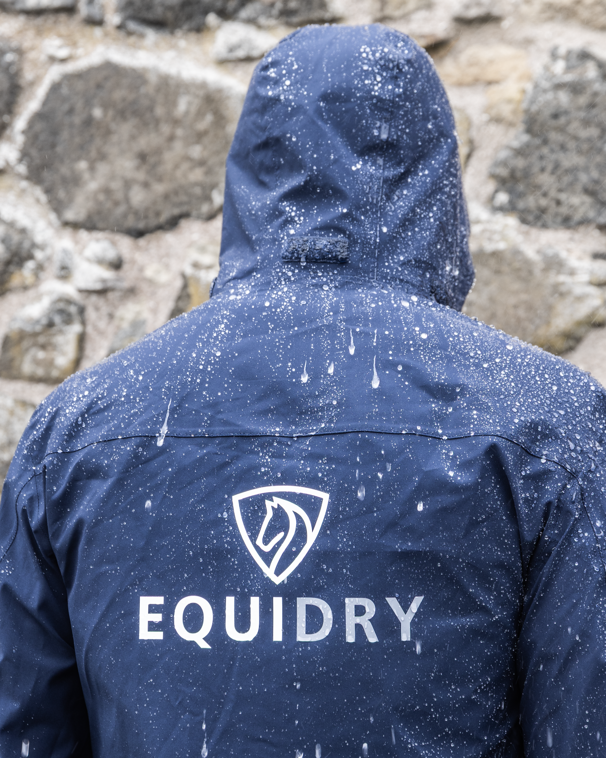 Equidry Nimbus Pack Away Jacket in Navy: Waterproof, lightweight equestrian raincoat with stowaway hood, perfect for riding in any weather.