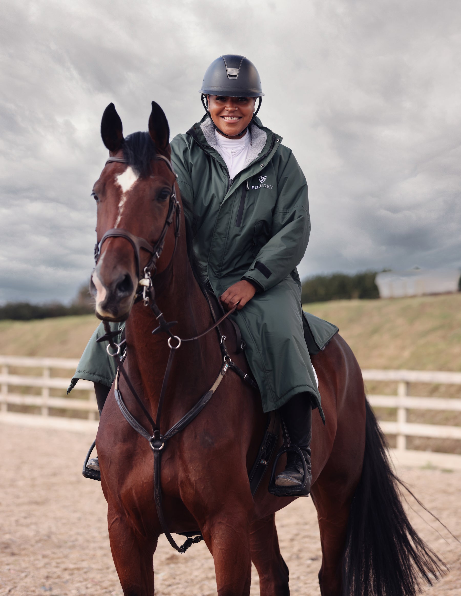 Equidry Black Forest Green Warm Waterproof Horse Riding Coat for Women with Fleece Lining. Rider on Horseback.