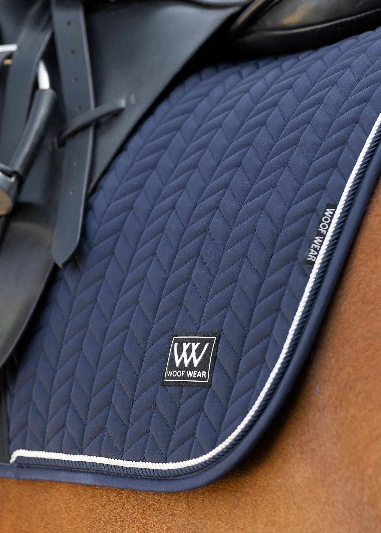 WOOF WEAR Herringbone Dressage Saddle Pad in Navy. High-quality horse riding equipment, horse training gear.