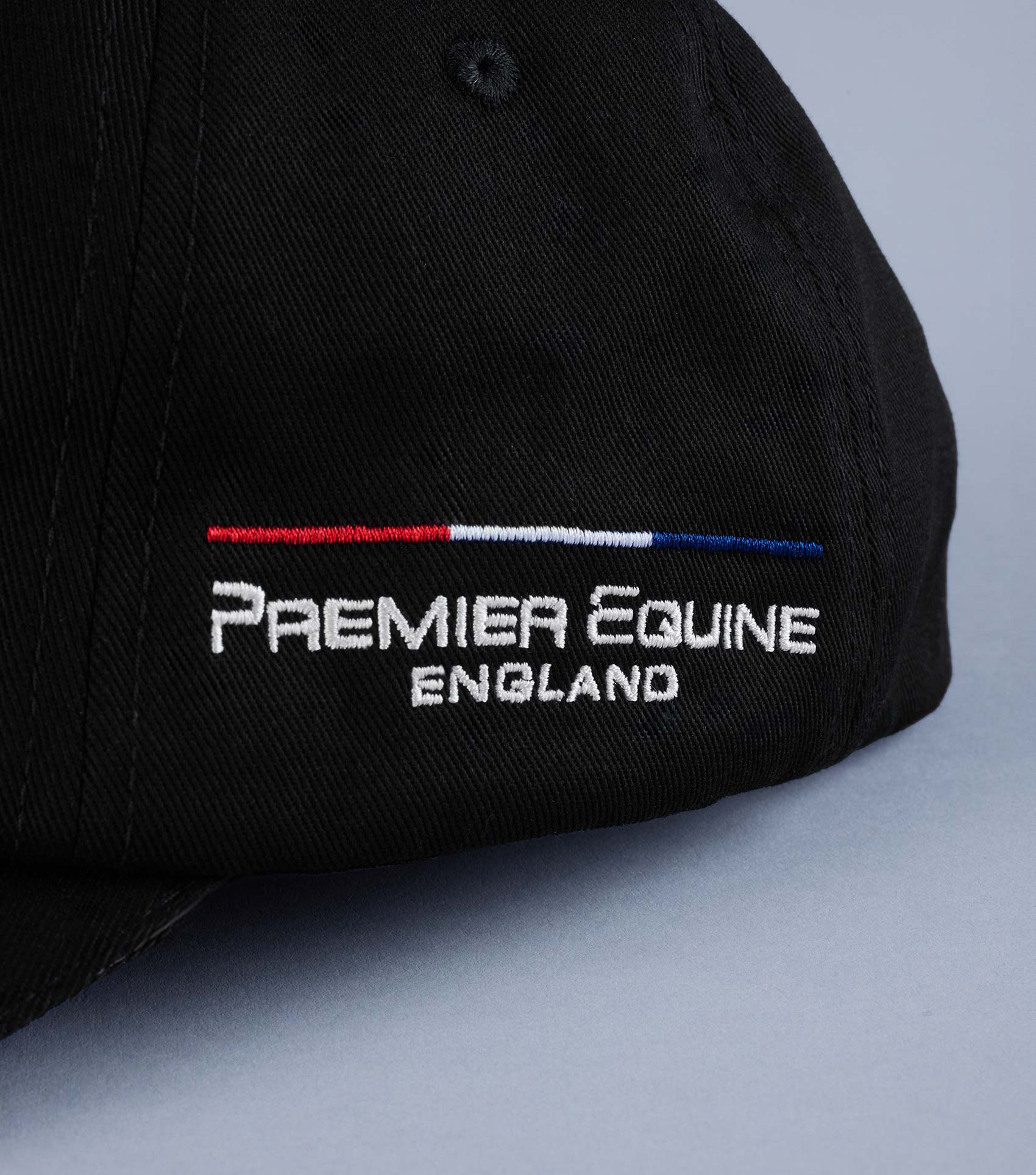 Premier Equine Black Baseball Cap: Embroidered Logo, Adjustable Strap. Made in England.